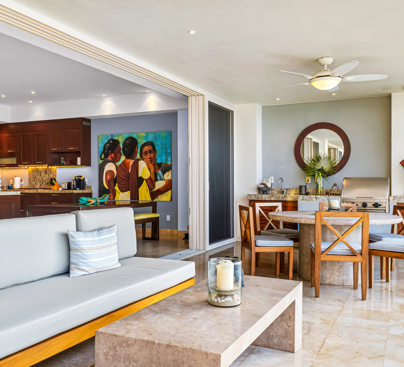 SDM Arco Major 4-30 Spacious indoor-outdoor living area with lounge seating, dining space, and ocean views. Oceanfront Sitting Area