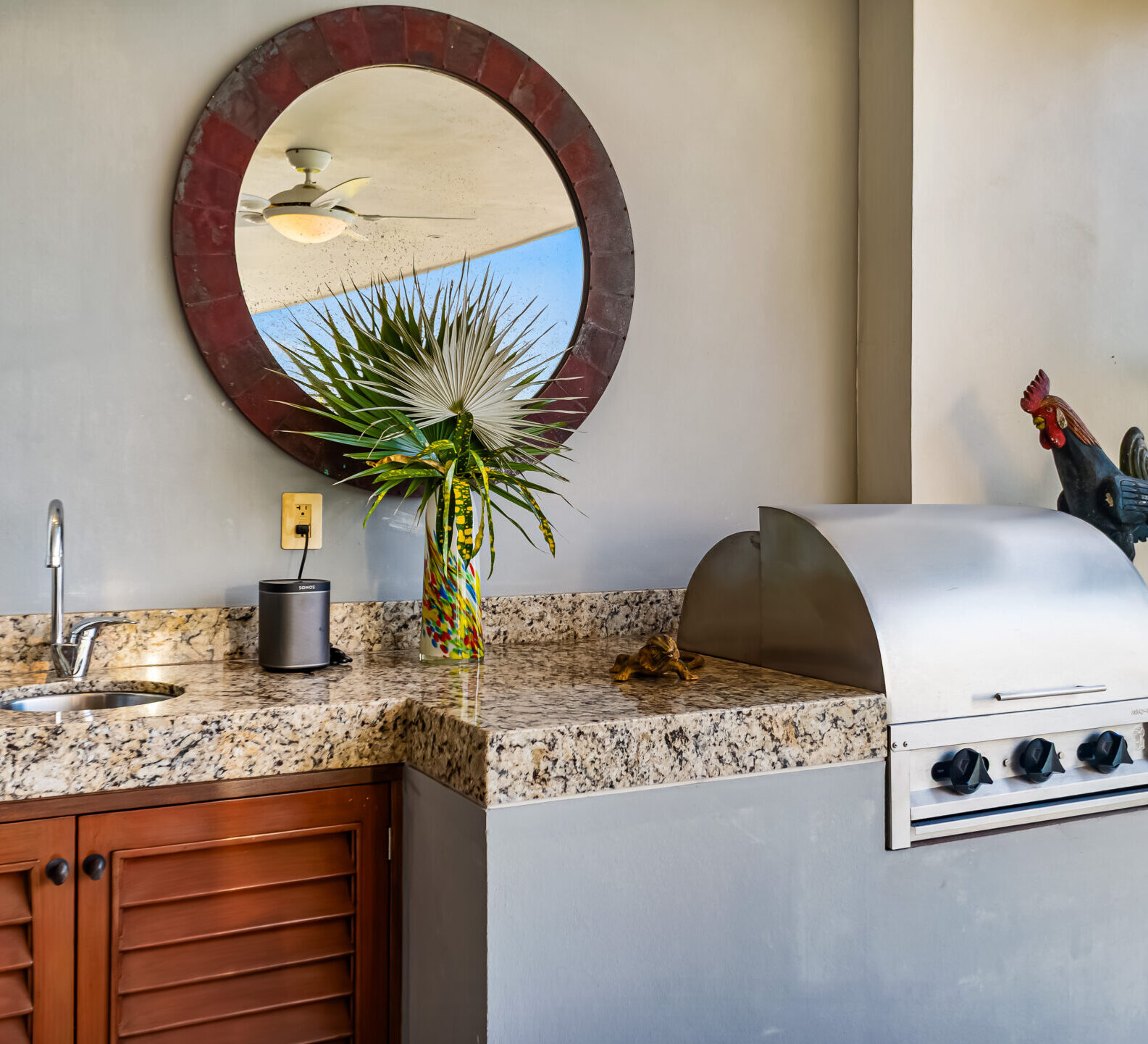 SDM Arco Major 4-36 Built-in outdoor barbecue station with granite countertops and ocean-view terrace access. Glass-Railed Balcony