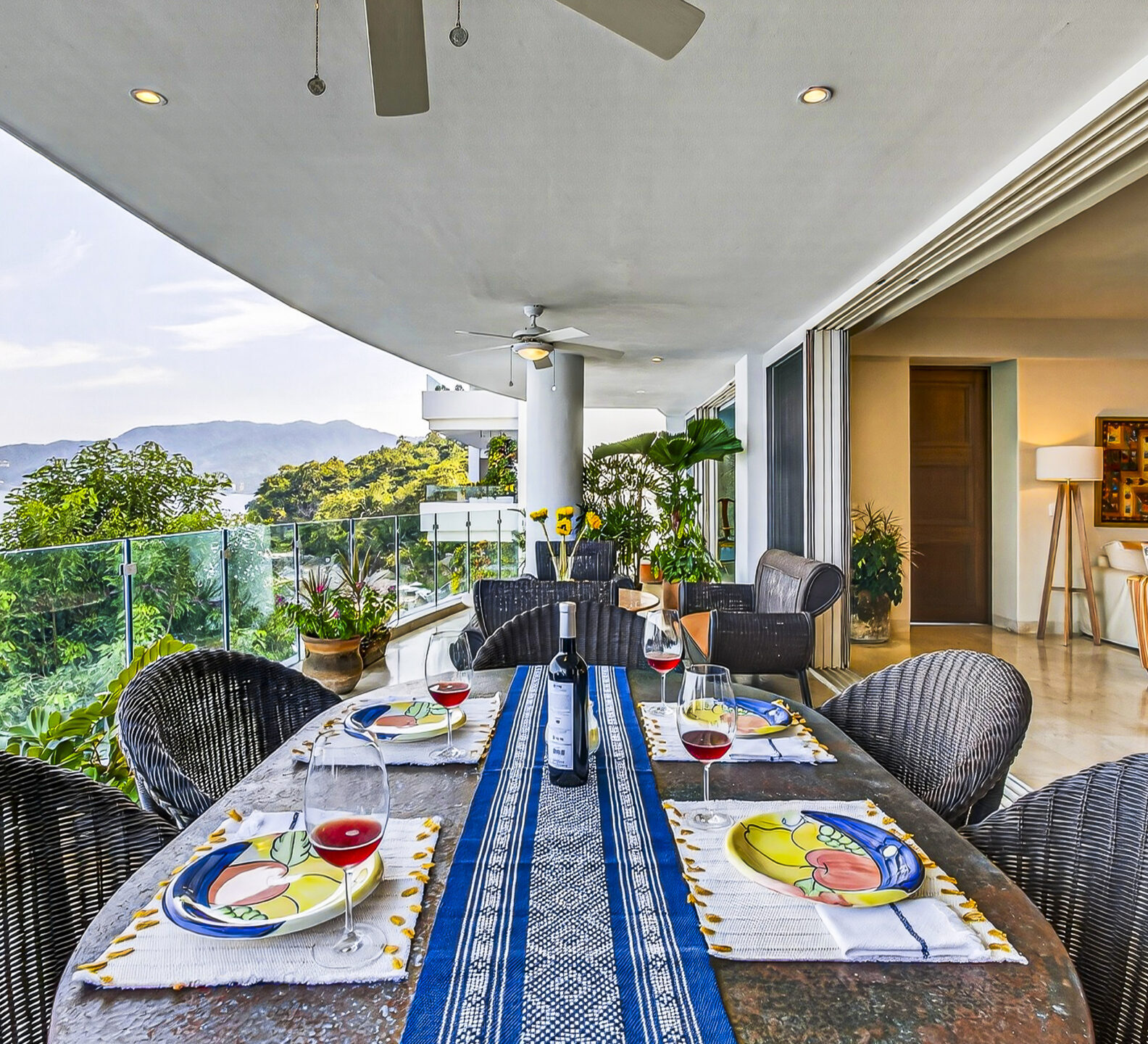 Spacious covered terrace with dining seating and direct access to the interior living area.